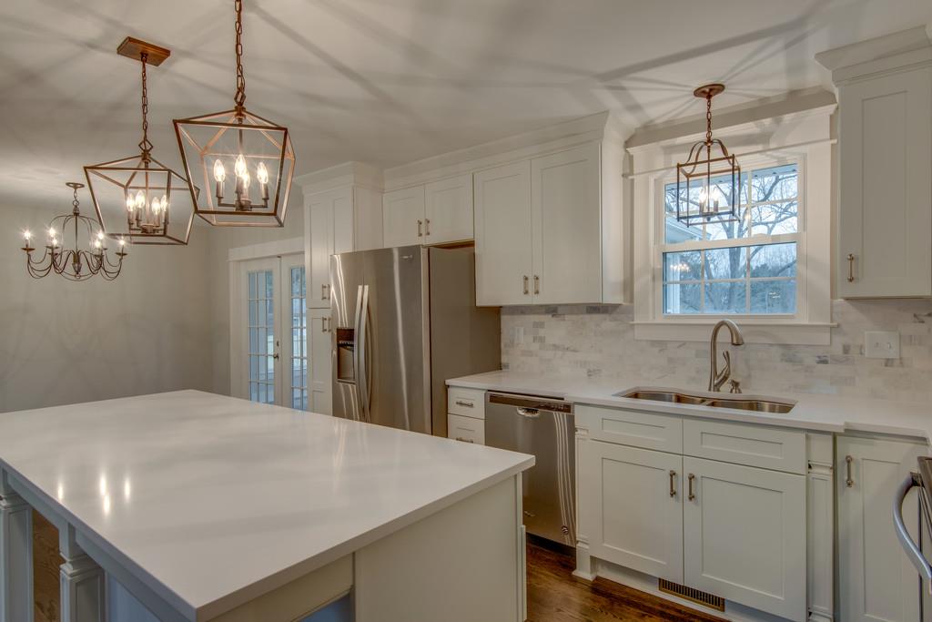 1200 Davidson Road Nashville, TN 37205 - Photo 9 of 30 a kitchen with stainless steel appliances a white table chairs and refrigerator
