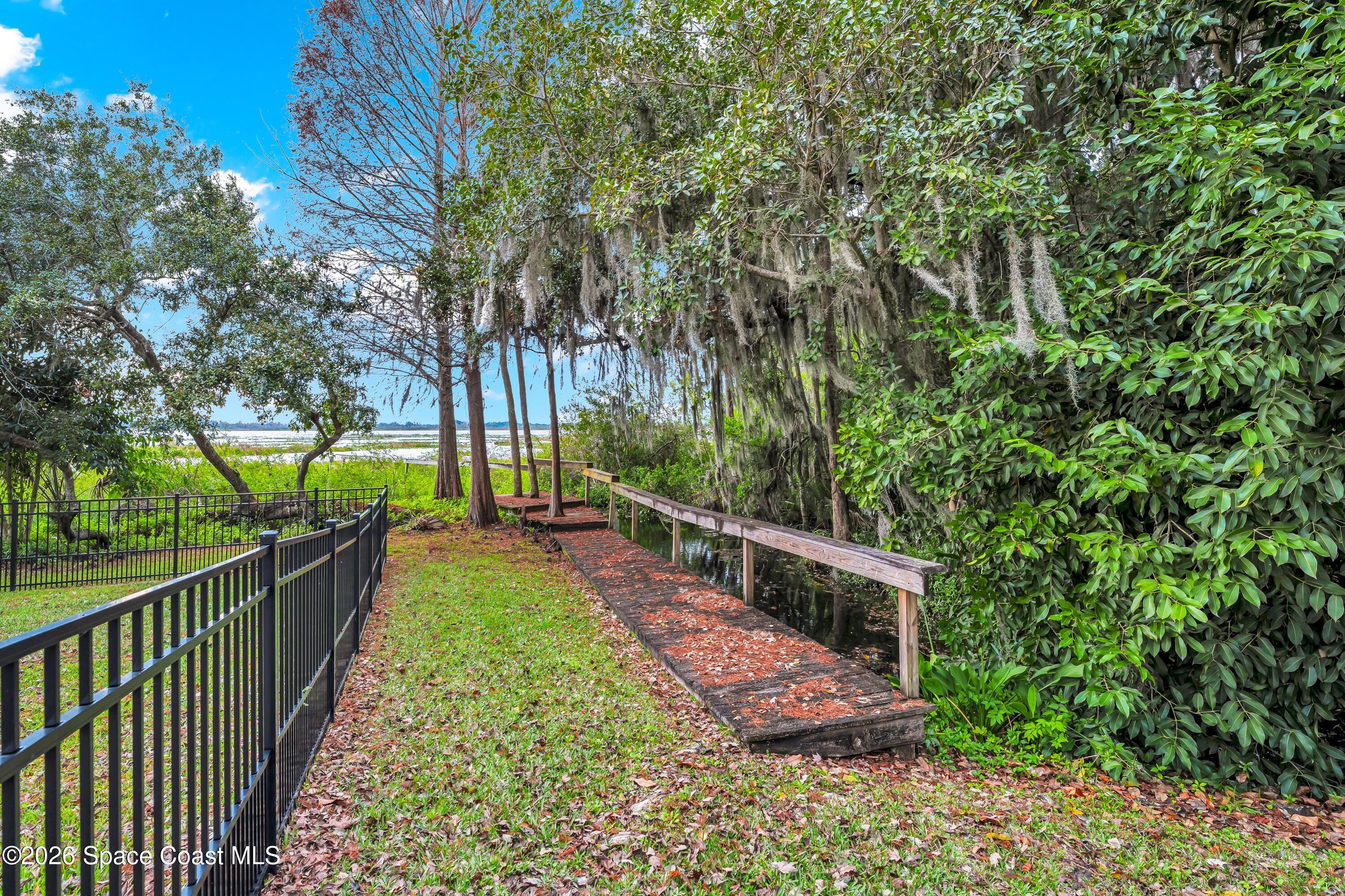 4150 Heller Road Titusville, FL 32796 - Photo 18 of 65 a view of a yard with large trees