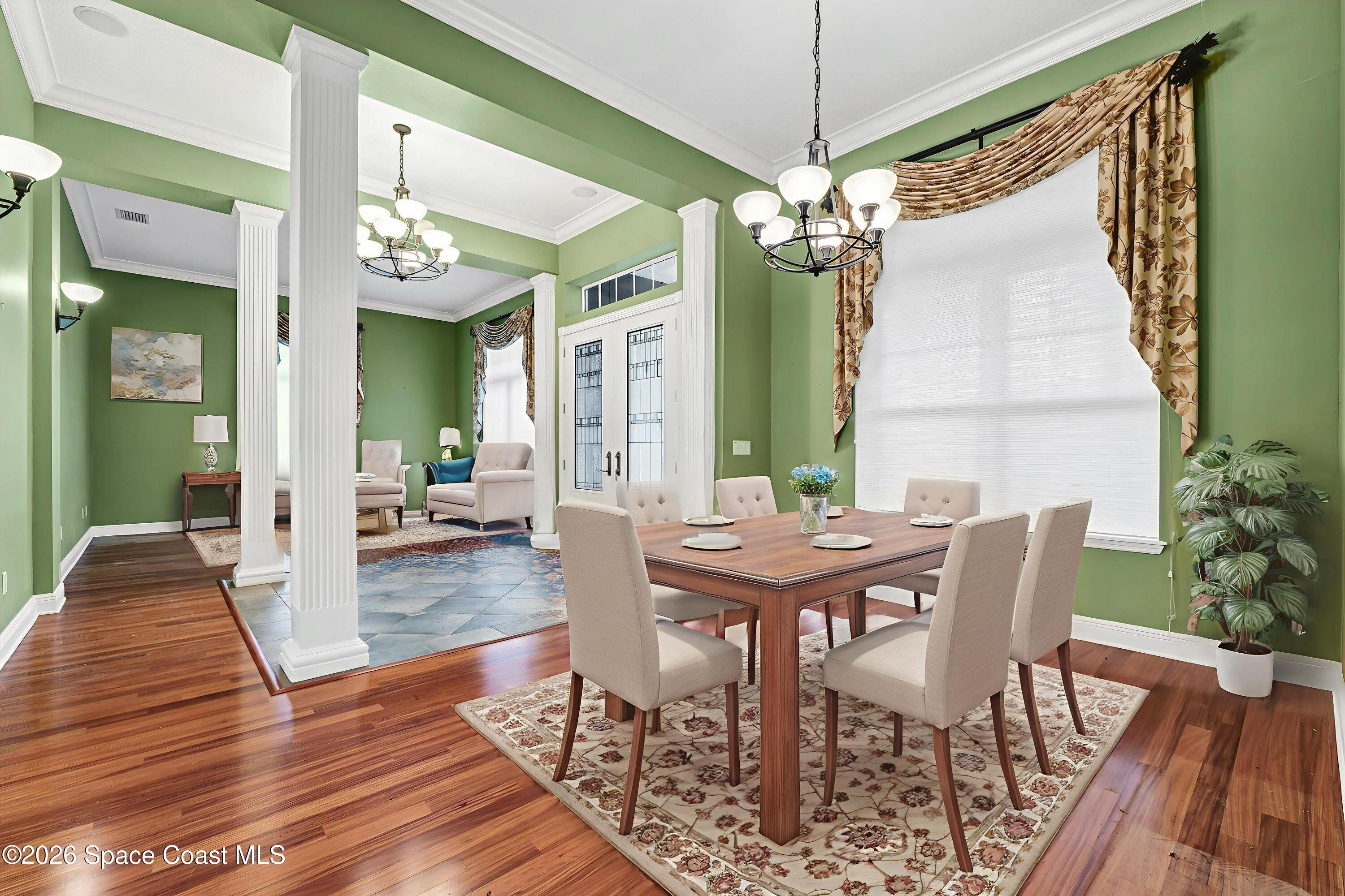 4150 Heller Road Titusville, FL 32796 - Photo 21 of 65 a view of a dining room with furniture window and wooden floor