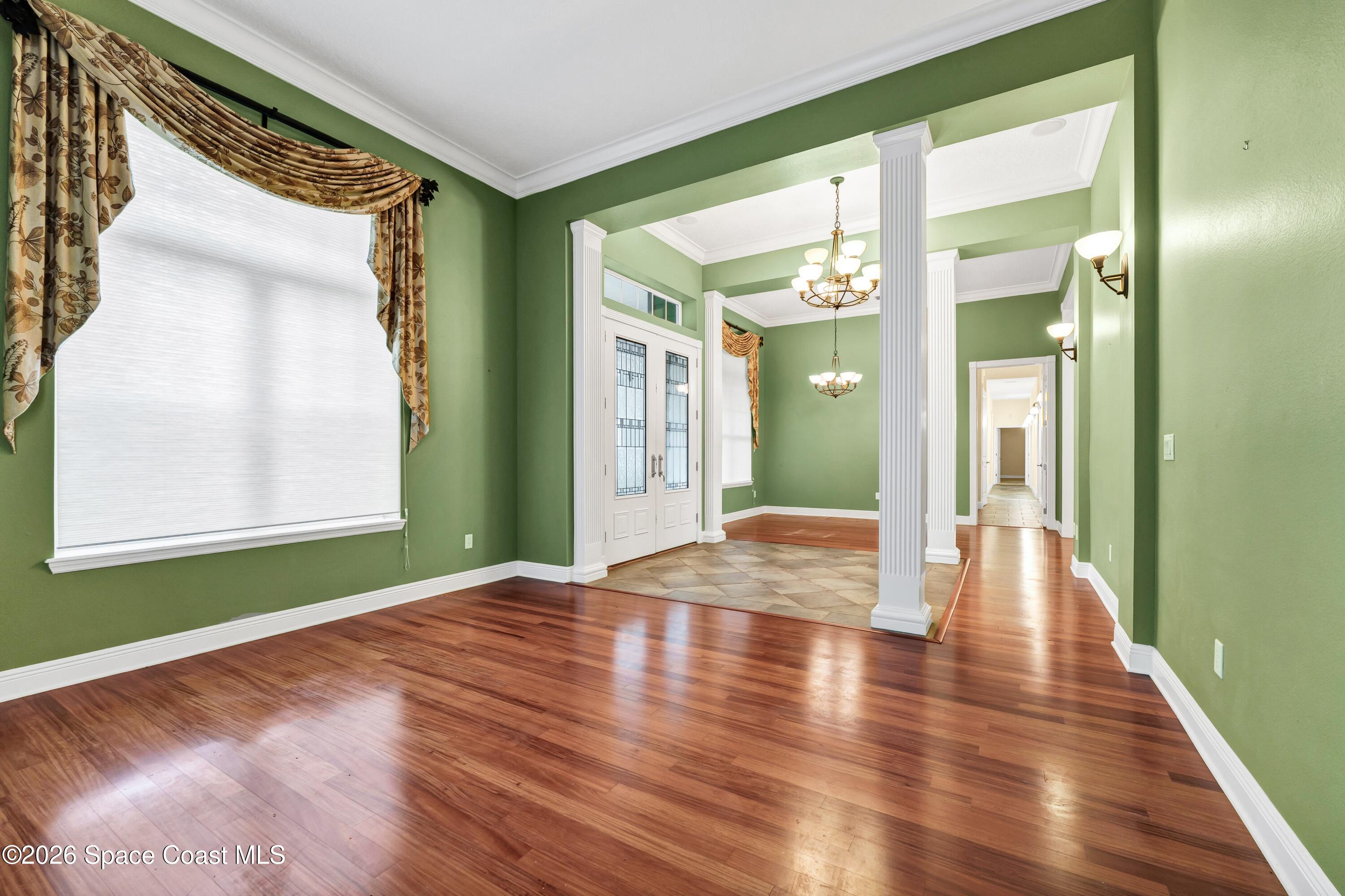 4150 Heller Road Titusville, FL 32796 - Photo 24 of 65 a view of an entryway with wooden floor and a window