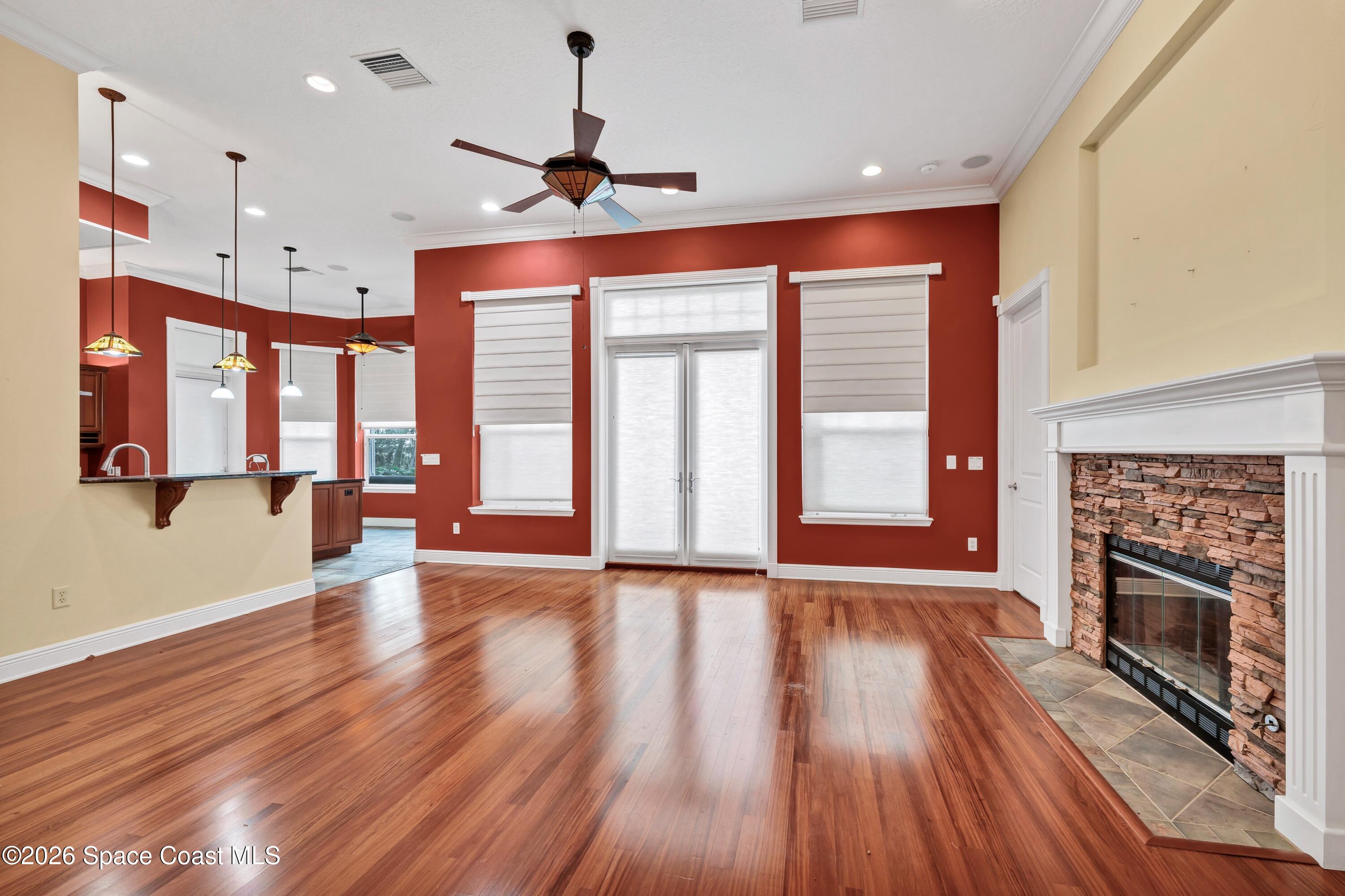 4150 Heller Road Titusville, FL 32796 - Photo 27 of 65 a view of an empty room with a fireplace and a window