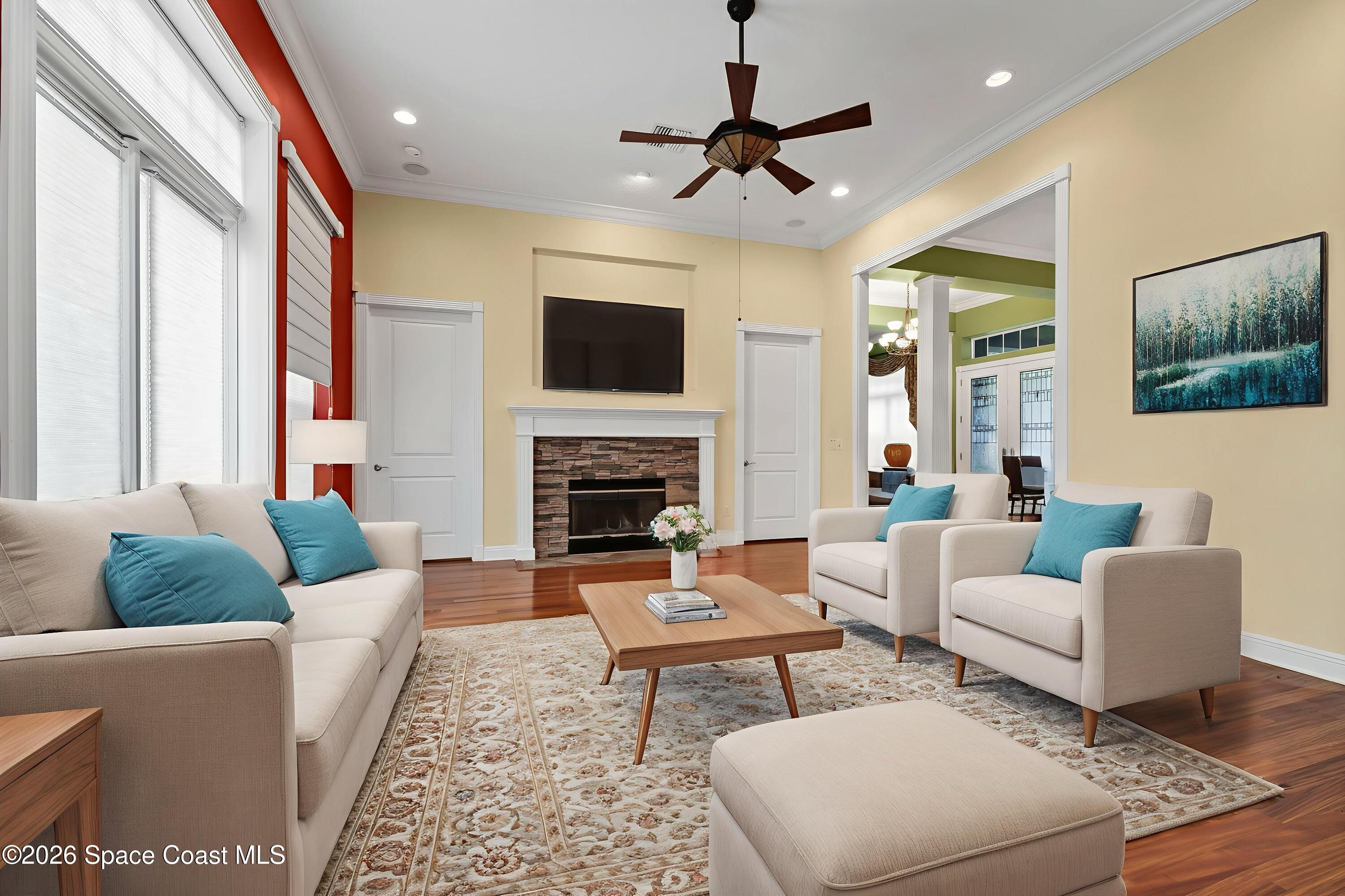 4150 Heller Road Titusville, FL 32796 - Photo 28 of 65 a living room with furniture fireplace and a flat screen tv