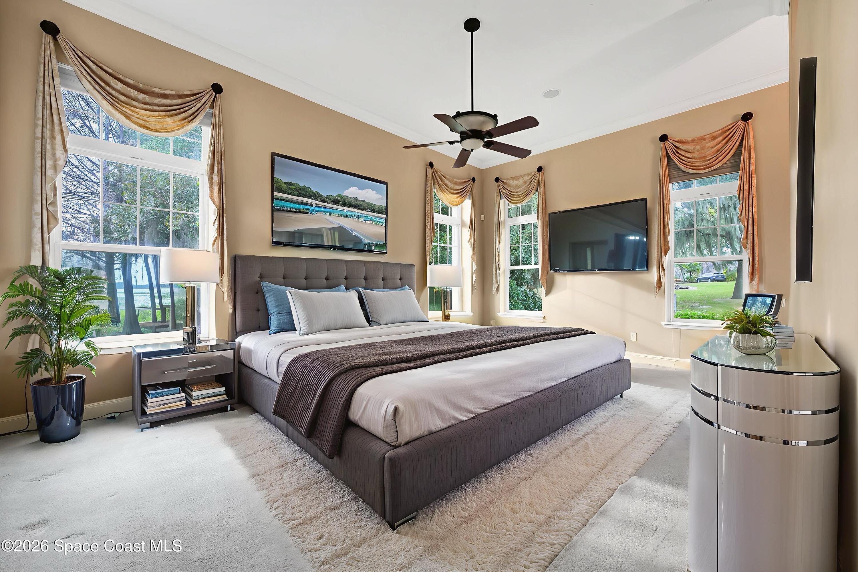 4150 Heller Road Titusville, FL 32796 - Photo 38 of 65 a bedroom with a bed and a couch
