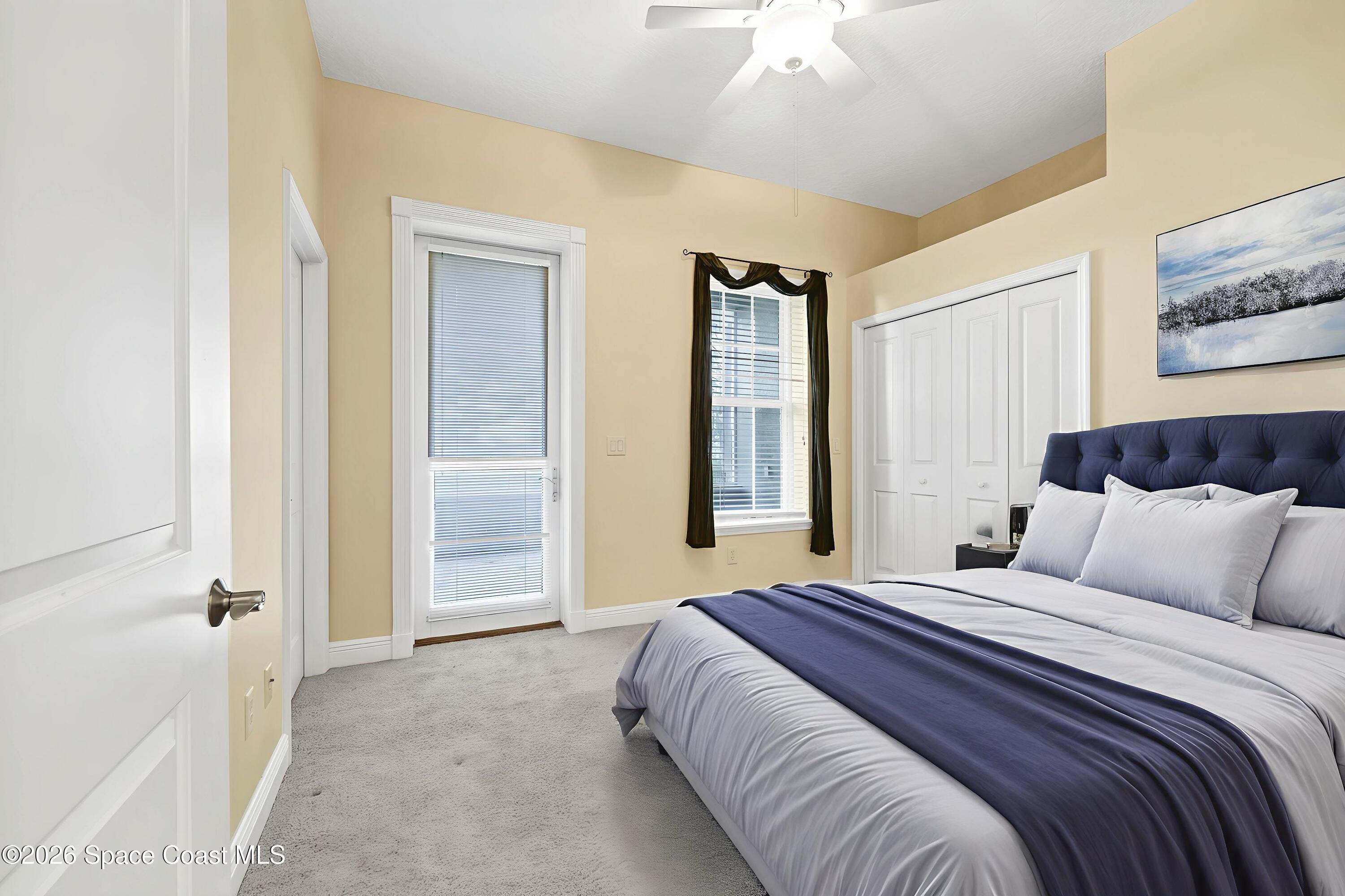 4150 Heller Road Titusville, FL 32796 - Photo 44 of 65 a bedroom with a bed and a chandelier