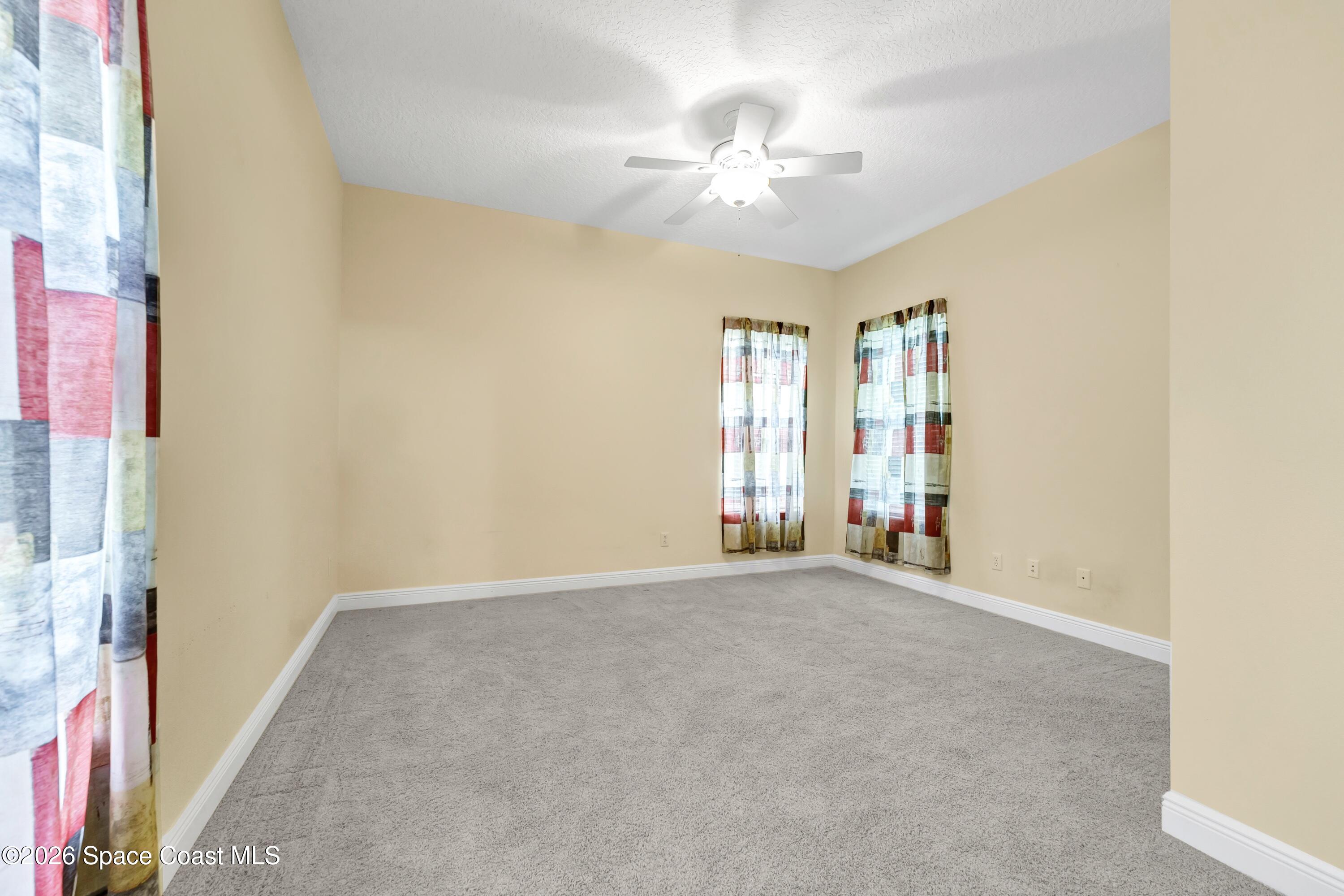 4150 Heller Road Titusville, FL 32796 - Photo 49 of 65 a view of an empty room with a window