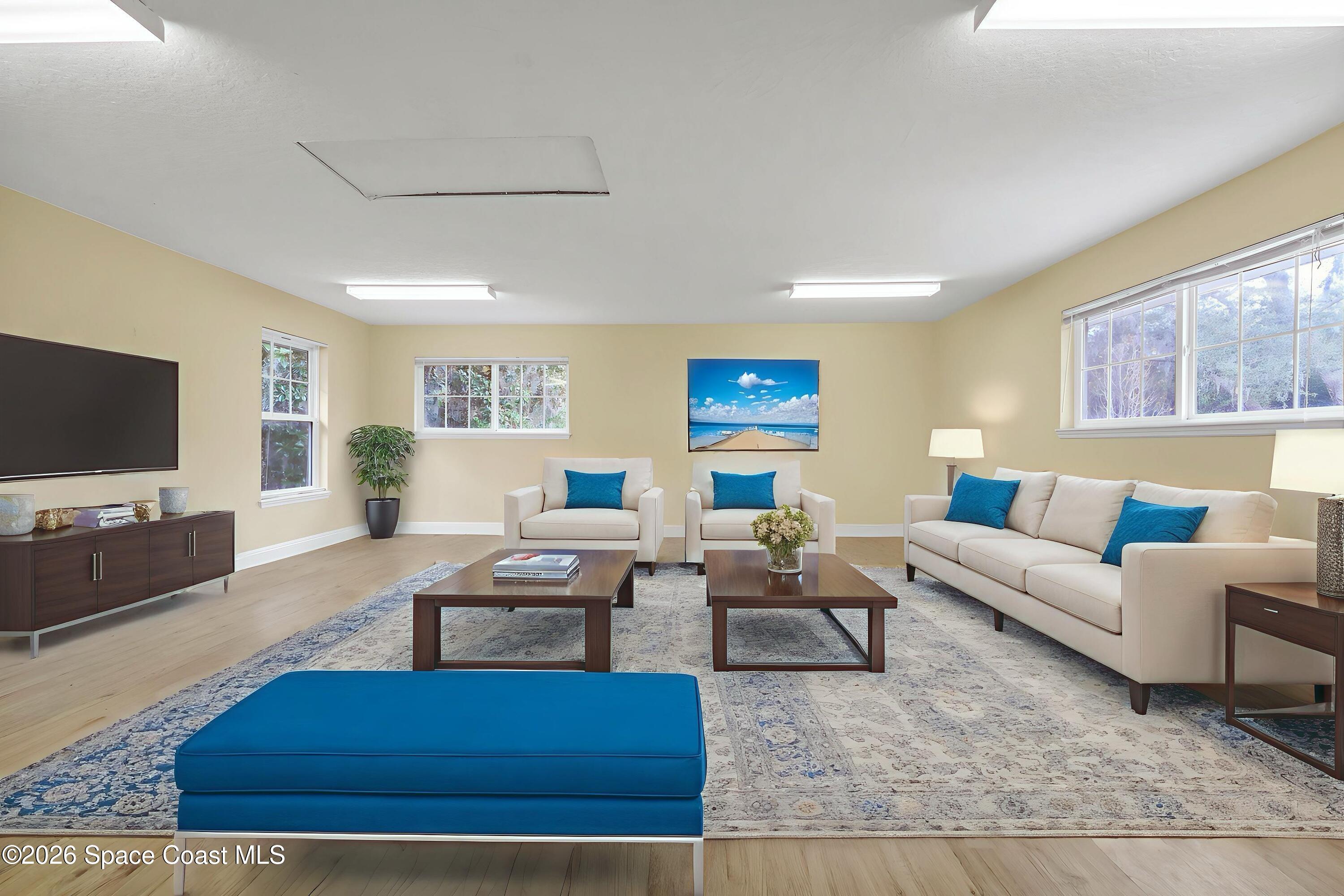 4150 Heller Road Titusville, FL 32796 - Photo 51 of 65 a living room with furniture and a flat screen tv