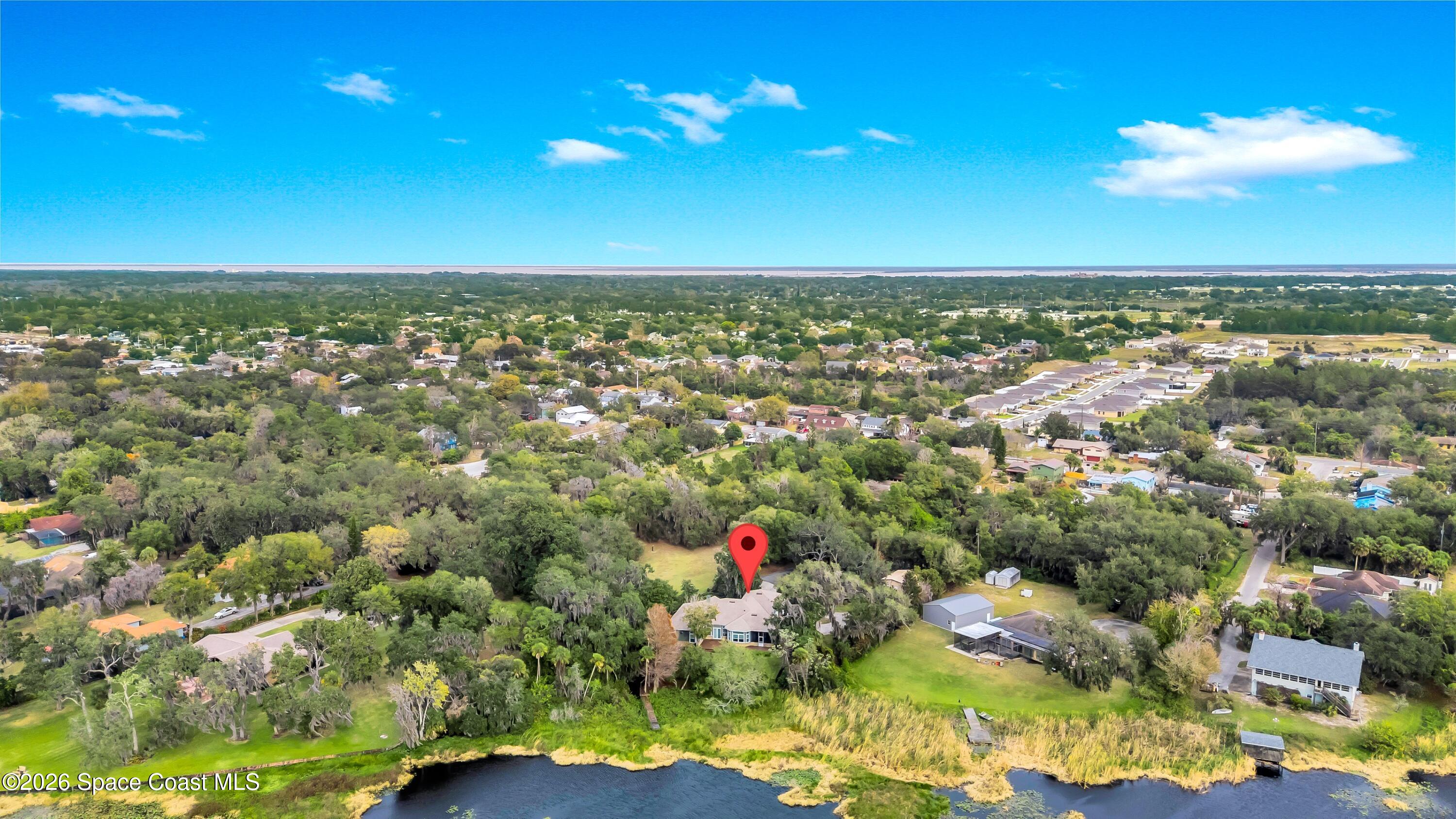 4150 Heller Road Titusville, FL 32796 - Photo 60 of 65 an aerial view of residential houses with outdoor space and swimming pool