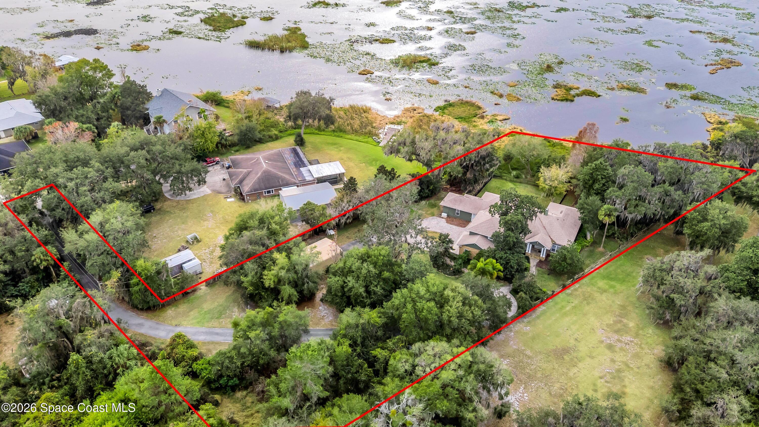 4150 Heller Road Titusville, FL 32796 - Photo 65 of 65 an aerial view of residential houses with outdoor space