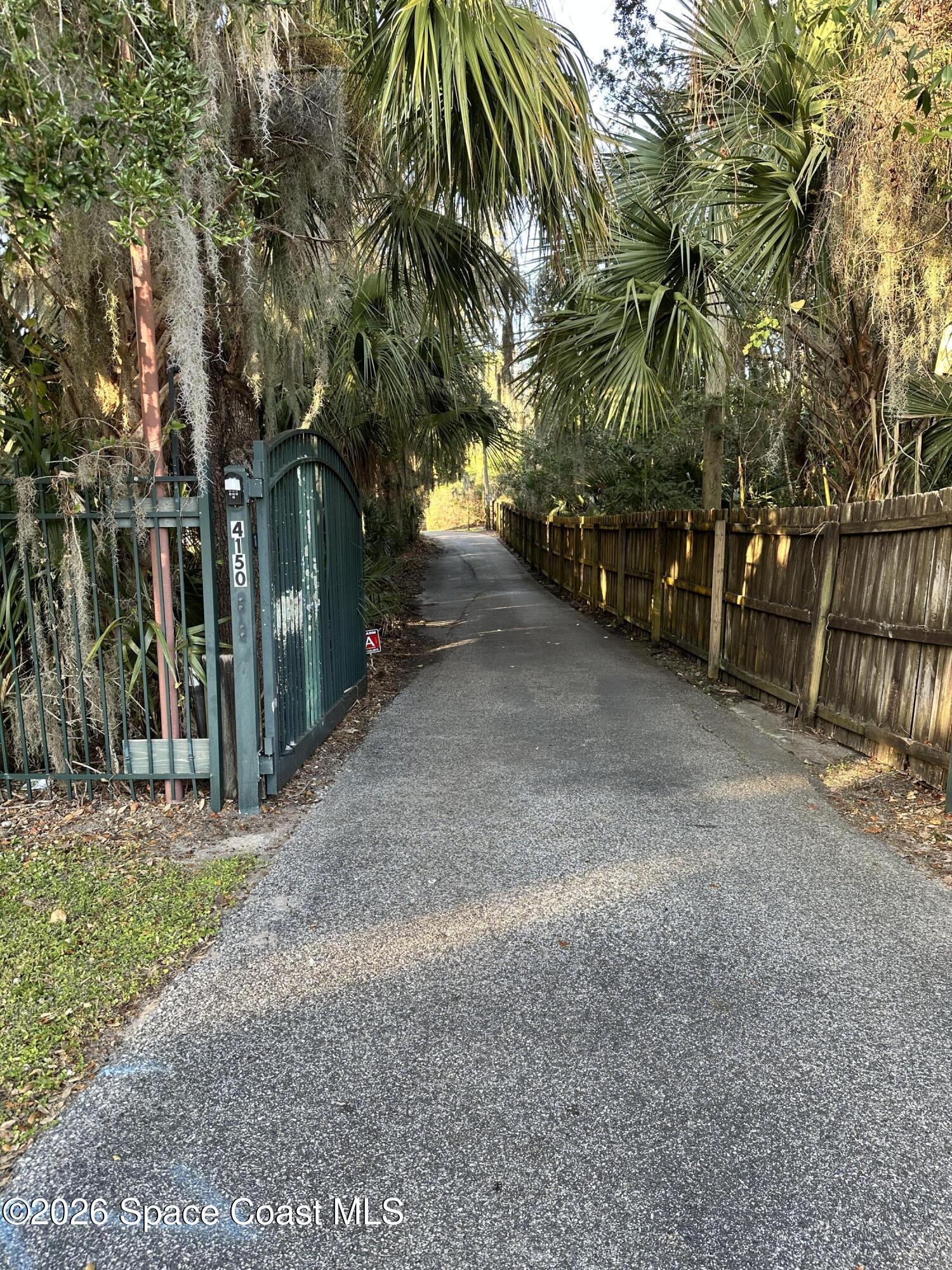 4150 Heller Road Titusville, FL 32796 - Photo 10 of 65 a view of road and trees