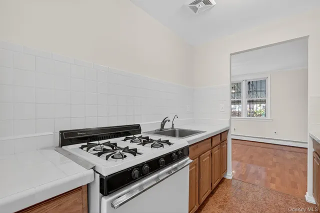 a kitchen with a stove and a sink