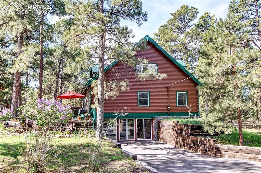5030 Cedar Way Elizabeth, CO 80107 - Photo 1 of 33 a front view of a house with garden