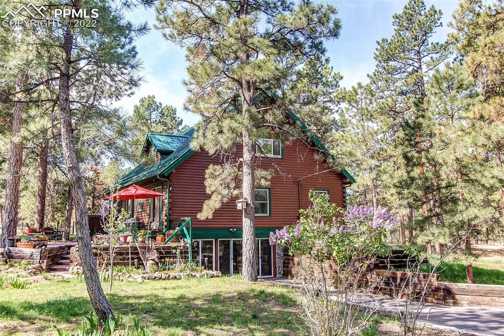 5030 Cedar Way Elizabeth, CO 80107 - Photo 18 of 33 a view of a house with a yard