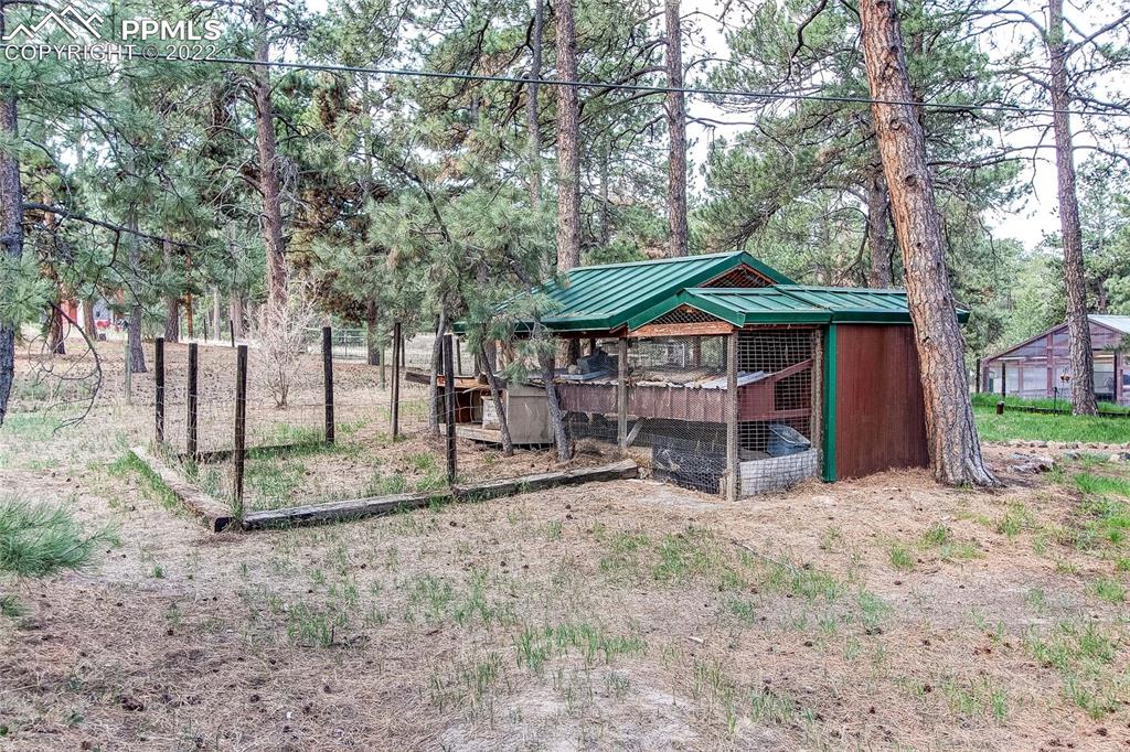 5030 Cedar Way Elizabeth, CO 80107 - Photo 21 of 33 a view of a house with a yard and sitting area