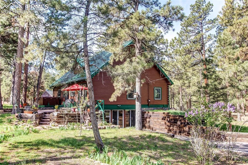 5030 Cedar Way Elizabeth, CO 80107 - Photo 3 of 33 a front view of a house with garden