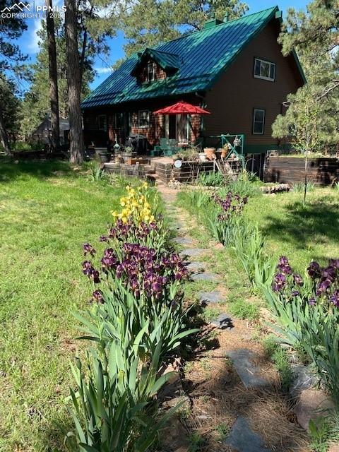 5030 Cedar Way Elizabeth, CO 80107 - Photo 4 of 33 a view of a house with a yard and sitting area