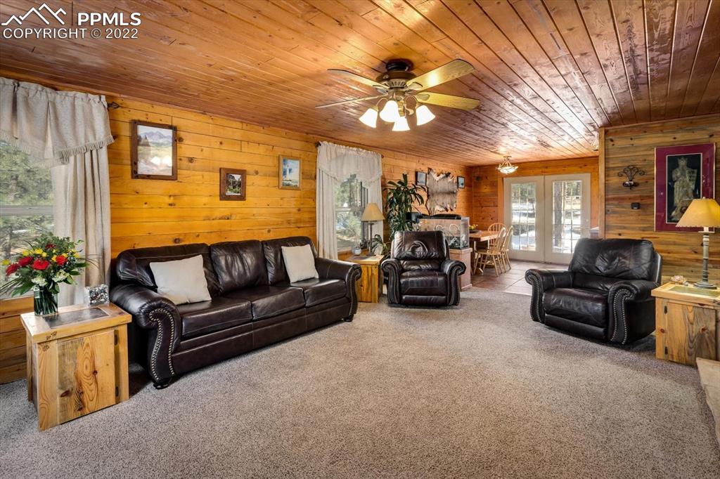 5030 Cedar Way Elizabeth, CO 80107 - Photo 7 of 33 a living room with furniture and a chandelier
