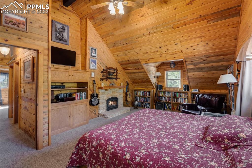 5030 Cedar Way Elizabeth, CO 80107 - Photo 8 of 33 a bed room with a bed and a television