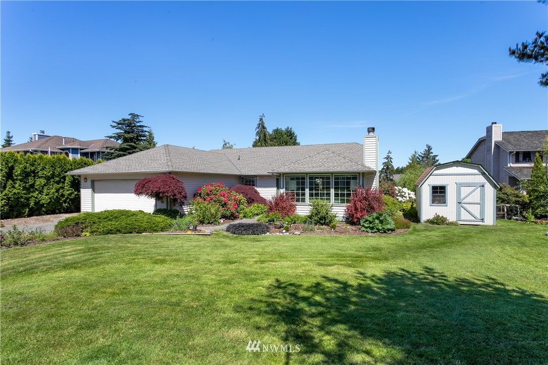 2003 237th Street Southeast Bothell, WA 98021 - Photo 2 of 25 a front view of a house with garden