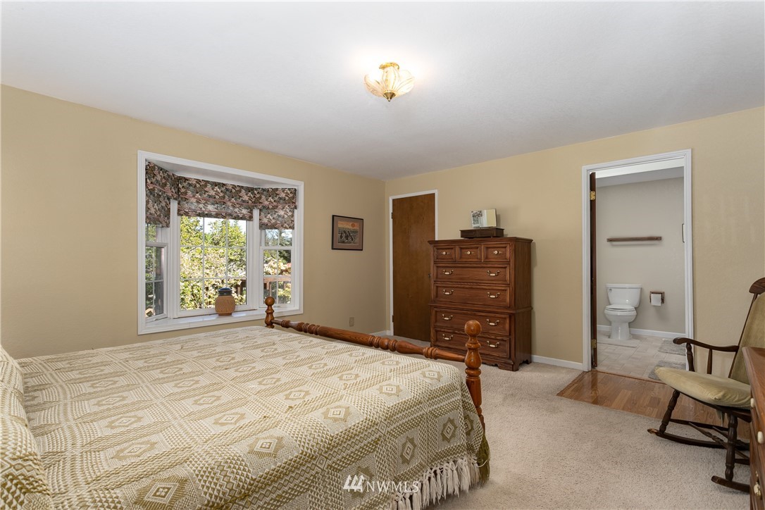 2003 237th Street Southeast Bothell, WA 98021 - Photo 15 of 25 a bedroom with a bed and furniture