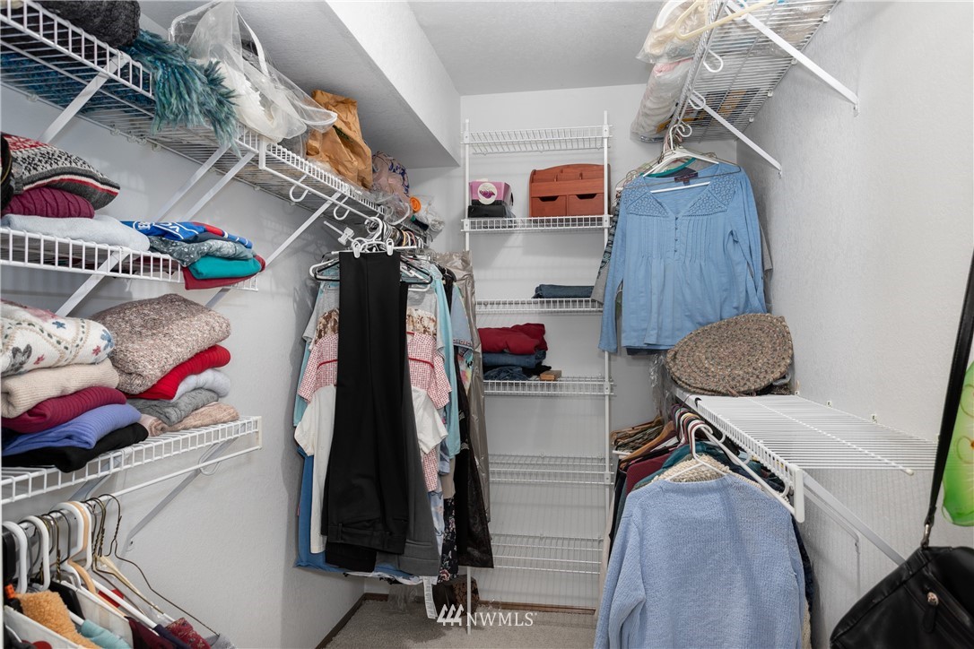 2003 237th Street Southeast Bothell, WA 98021 - Photo 16 of 25 a view of walk in closet with clothes and shoes