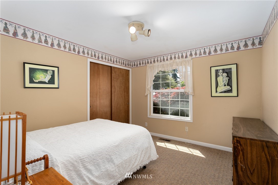 2003 237th Street Southeast Bothell, WA 98021 - Photo 18 of 25 a bedroom with a bed and a window