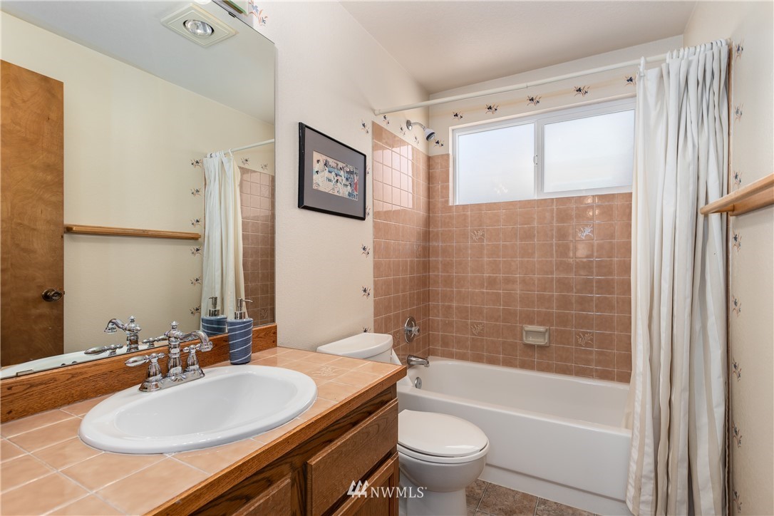 2003 237th Street Southeast Bothell, WA 98021 - Photo 20 of 25 a bathroom with a sink a toilet and shower