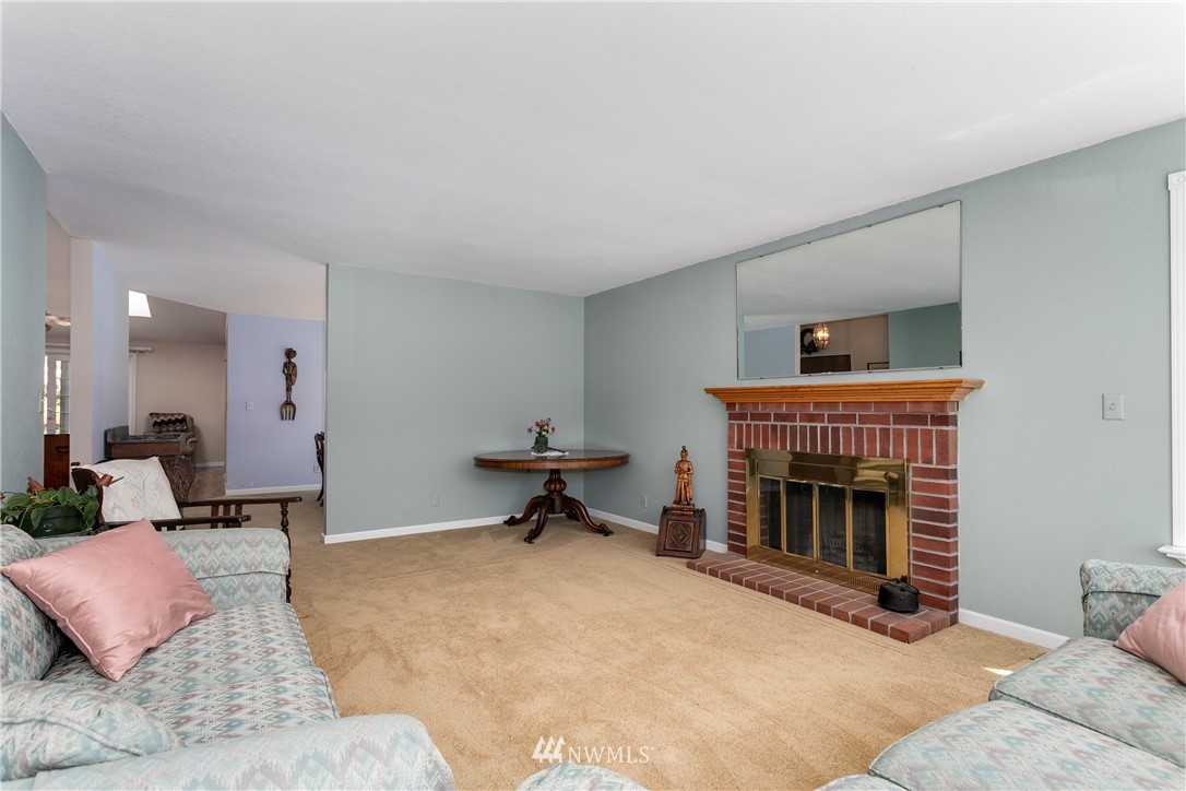 2003 237th Street Southeast Bothell, WA 98021 - Photo 5 of 25 a living room with furniture a fireplace and a fireplace