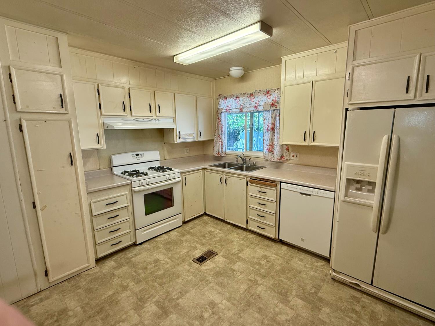 2958 Spring View Lane Placerville, CA 95667 - Photo 8 of 23 a kitchen with white cabinets and white appliances