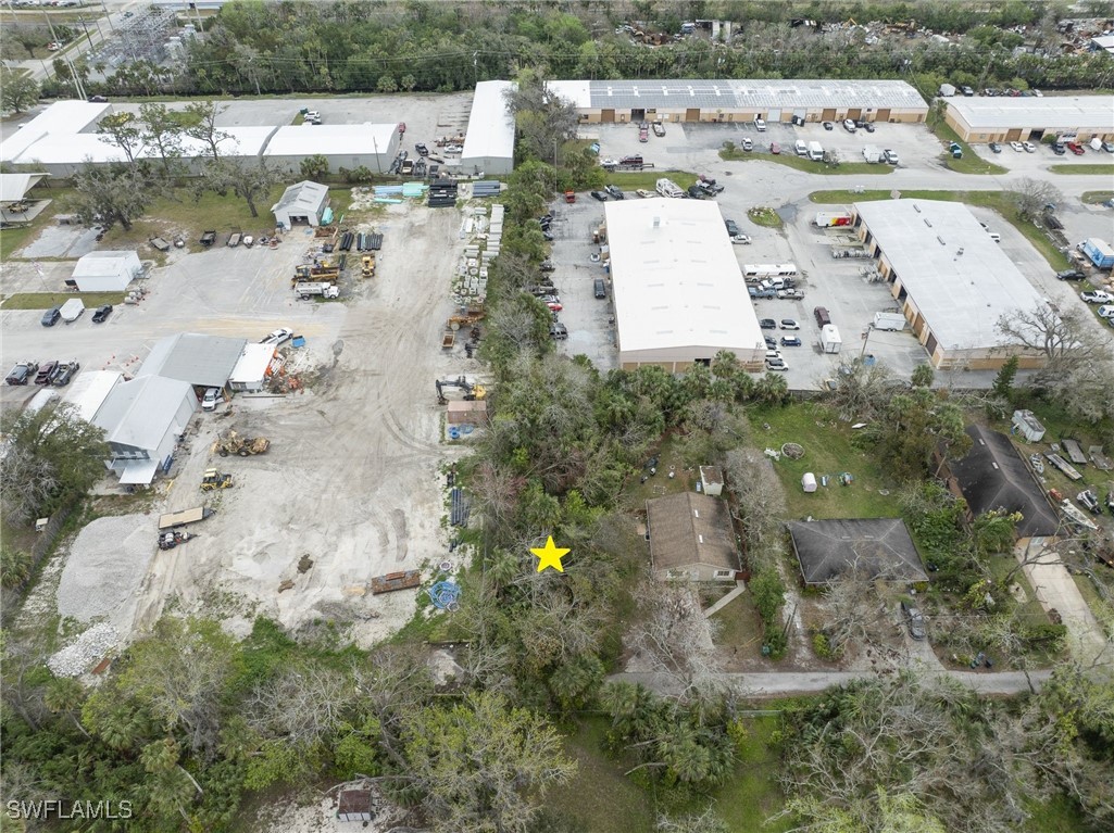 1137 Cave Avenue Holly Hill, FL 32117 - Photo 5 of 12 an aerial view of a house with a yard and lake view