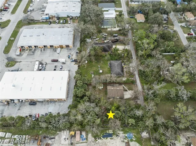 an aerial view of residential house with outdoor space