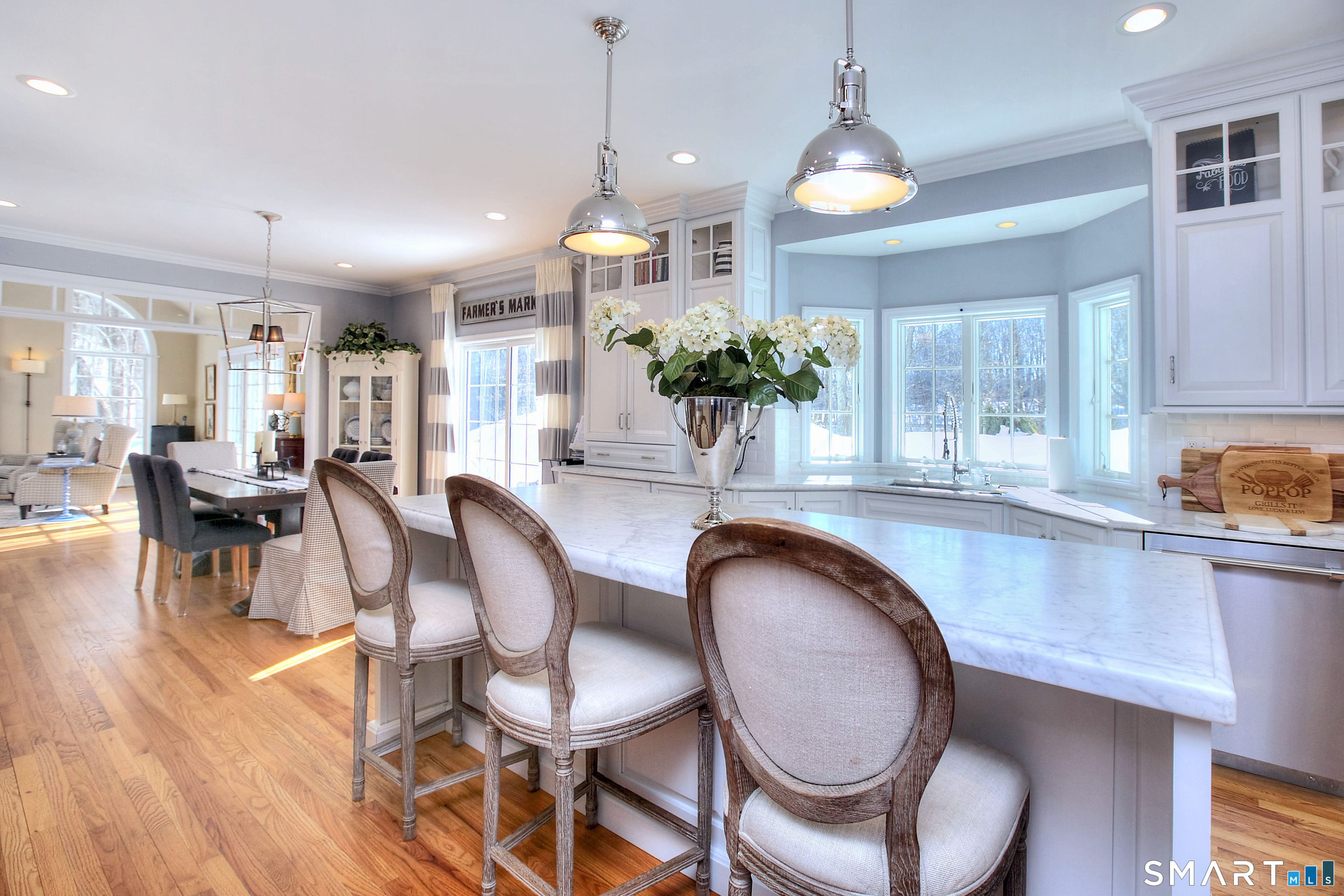 28 Great Pond Road Ridgefield, CT 06877 - Photo 14 of 40 a dining room filled chandelier and wooden floor