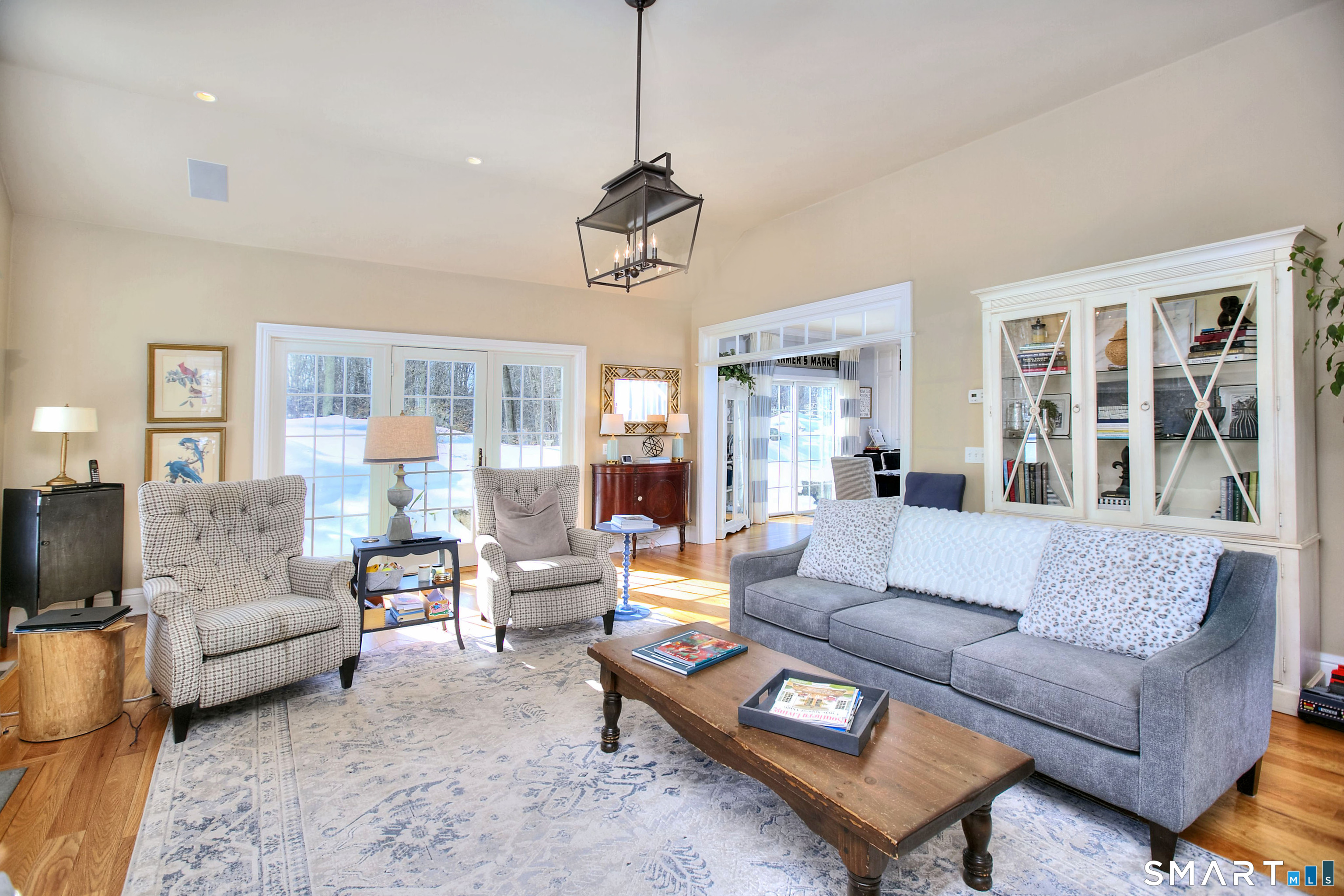 28 Great Pond Road Ridgefield, CT 06877 - Photo 19 of 40 a living room with furniture dining table and a chandelier