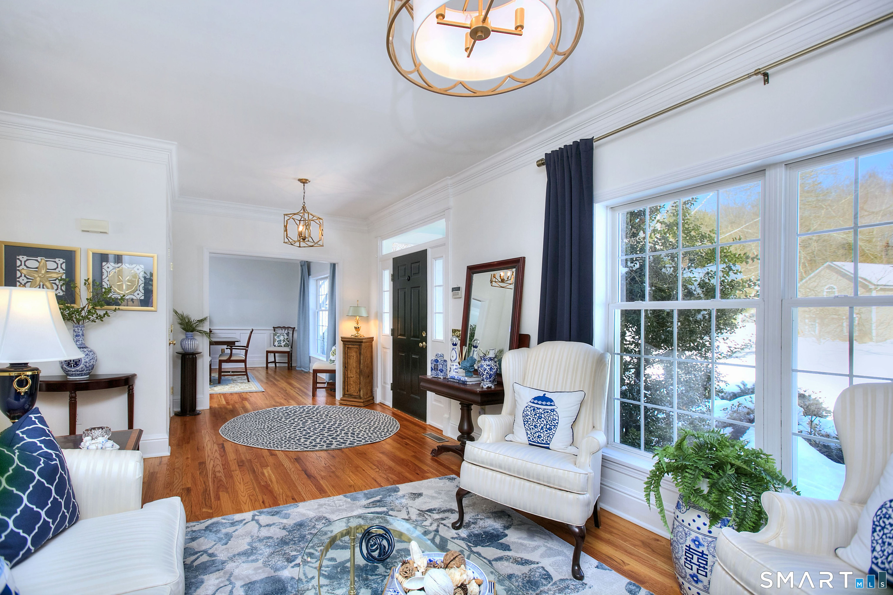 28 Great Pond Road Ridgefield, CT 06877 - Photo 23 of 40 a living room with furniture a table and decor