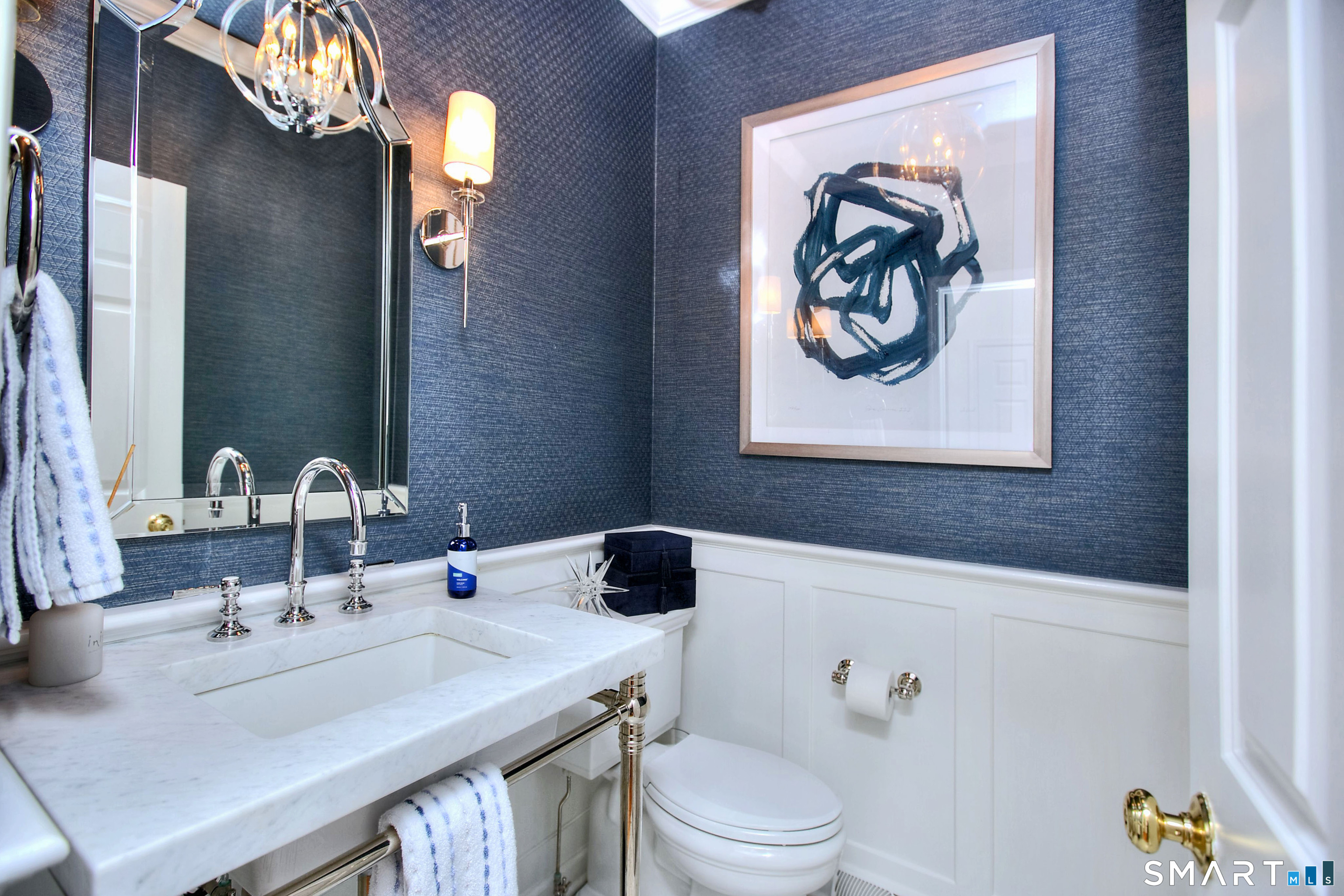 28 Great Pond Road Ridgefield, CT 06877 - Photo 24 of 40 a bathroom with a sink a toilet and a mirror