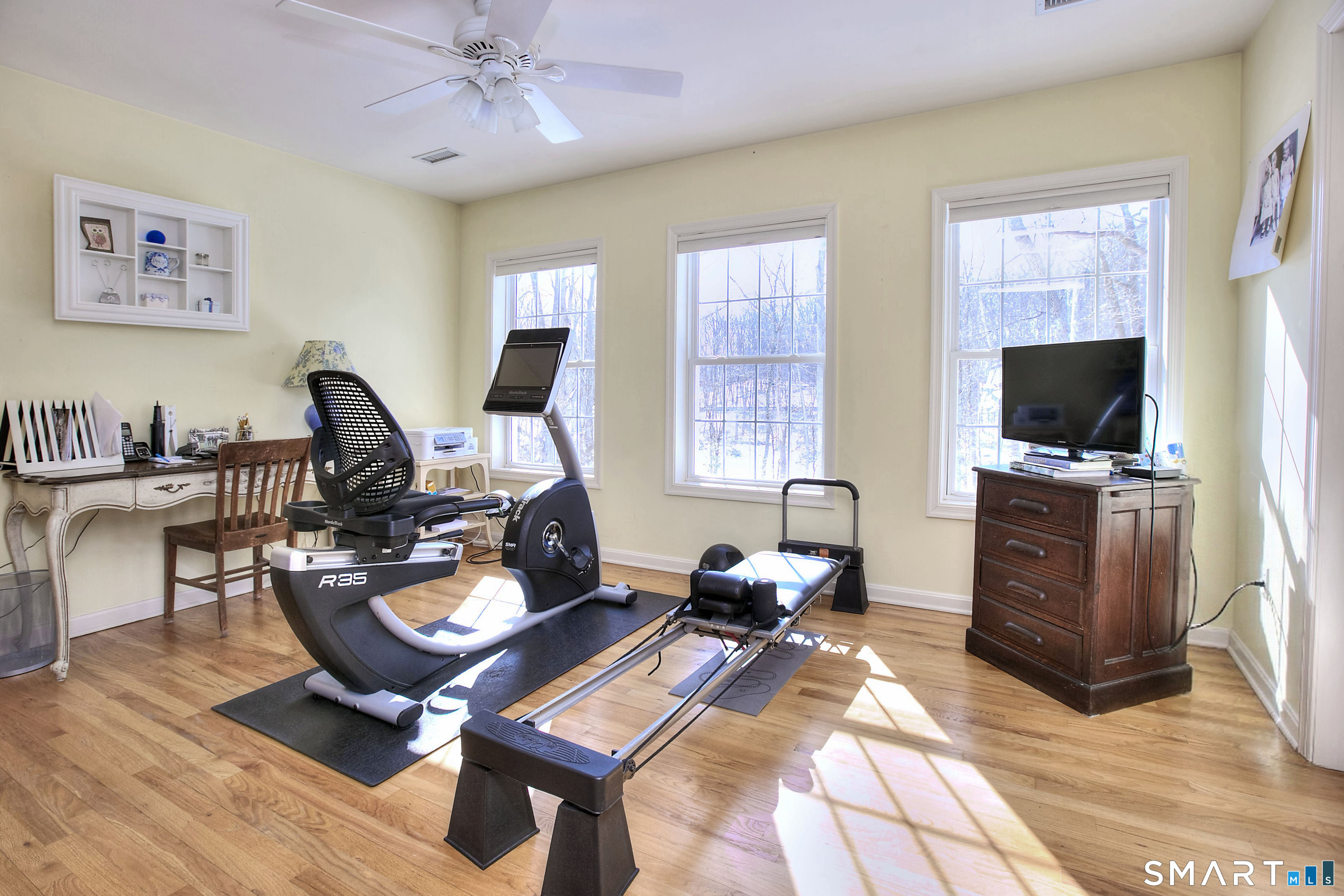 28 Great Pond Road Ridgefield, CT 06877 - Photo 37 of 40 a living room with furniture a flat screen tv and kitchen view