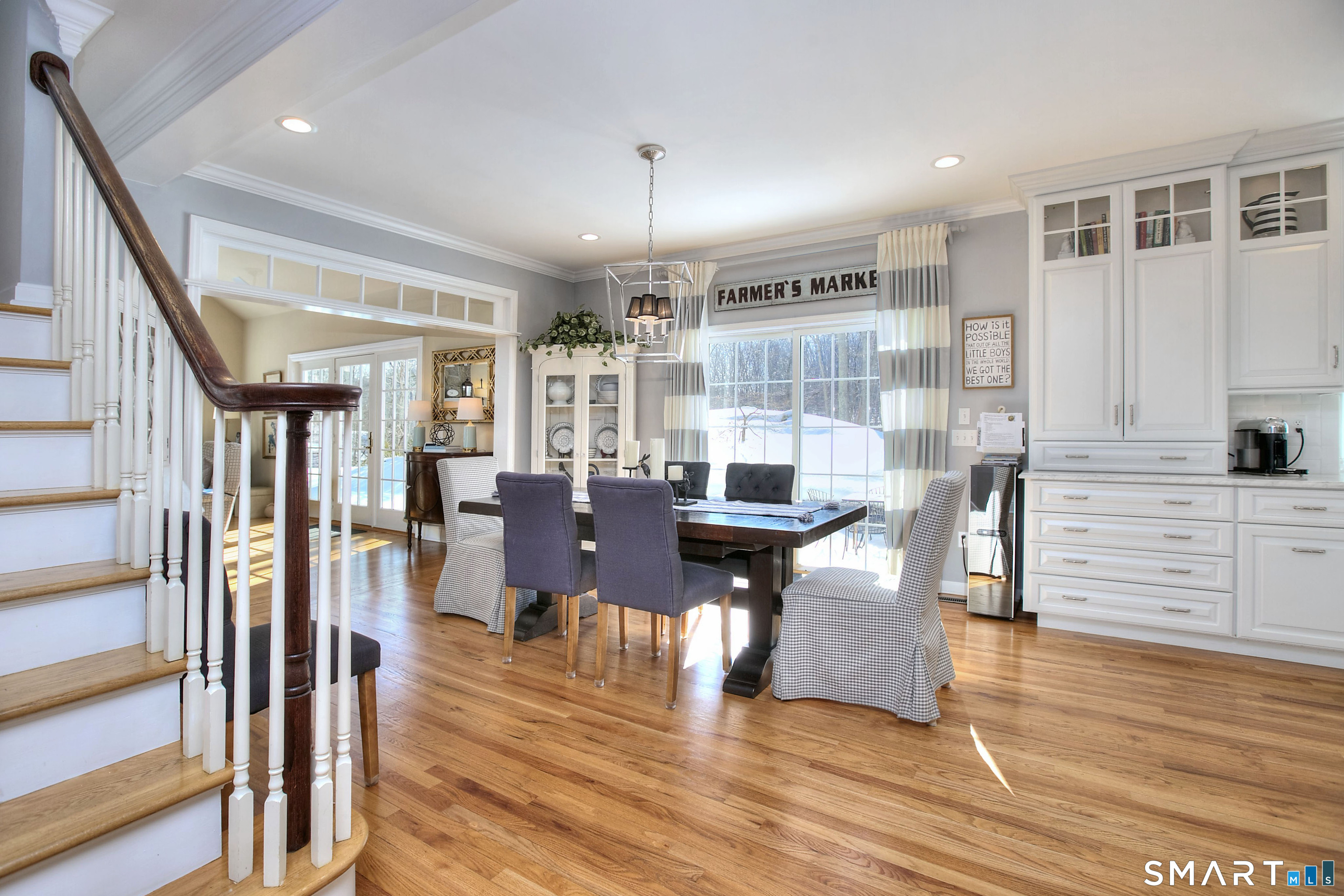 28 Great Pond Road Ridgefield, CT 06877 - Photo 5 of 40 a view of a dining room with furniture and wooden floor