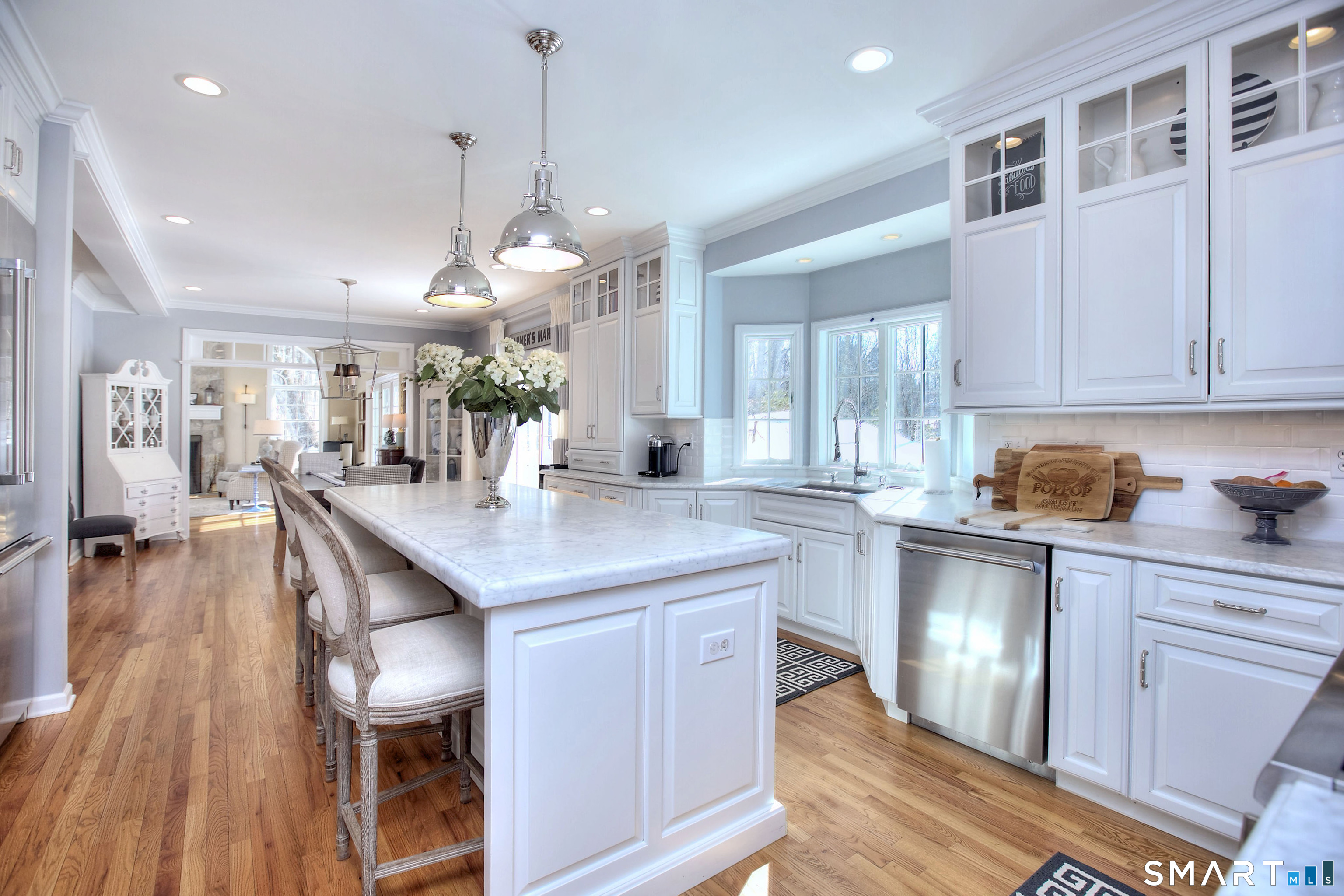 28 Great Pond Road Ridgefield, CT 06877 - Photo 7 of 40 a kitchen with stainless steel appliances granite countertop kitchen island wooden floors and center island