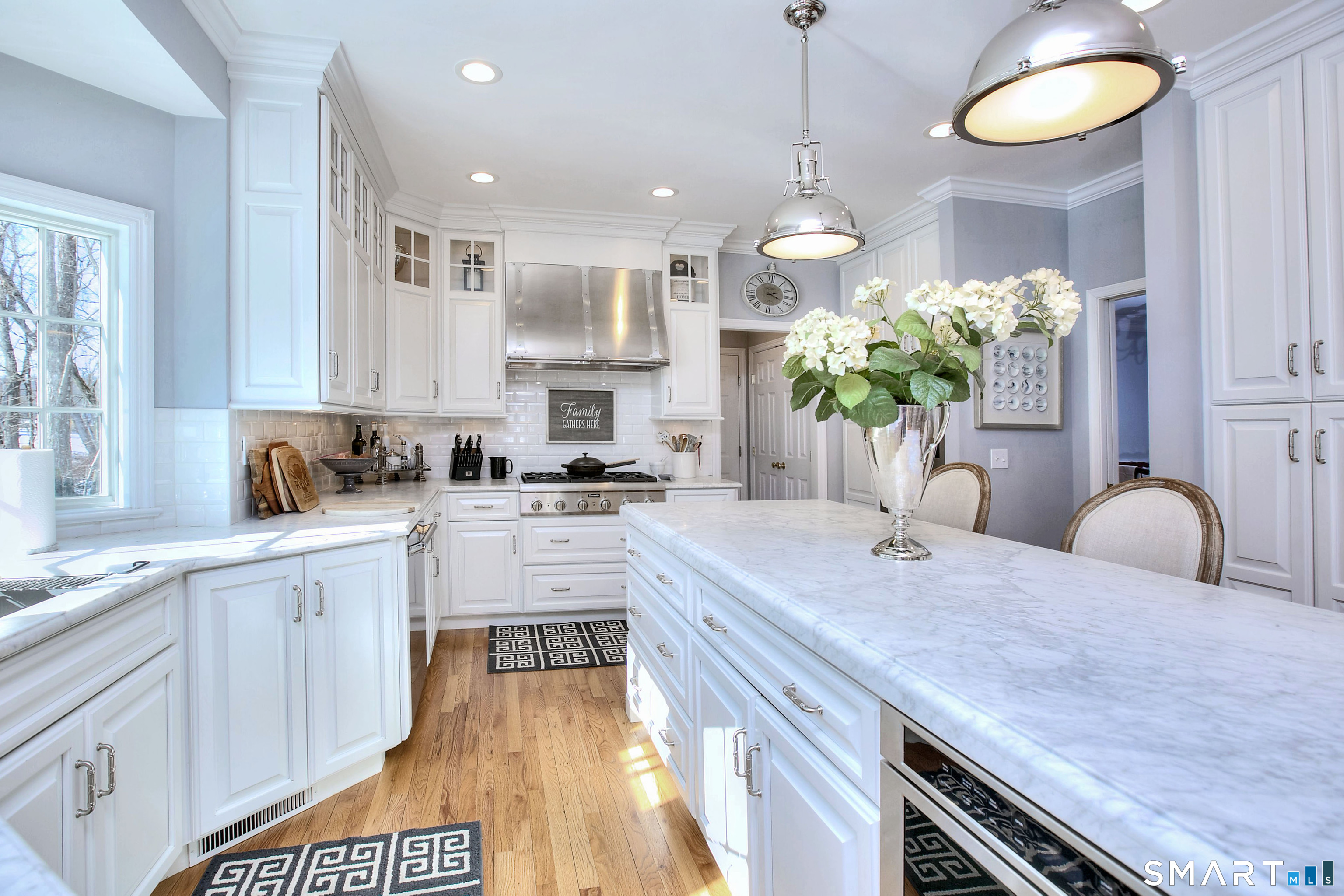 28 Great Pond Road Ridgefield, CT 06877 - Photo 10 of 40 a view of kitchen with sink dining table and chairs