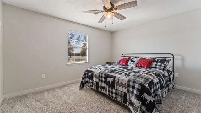 a bedroom with a bed and window