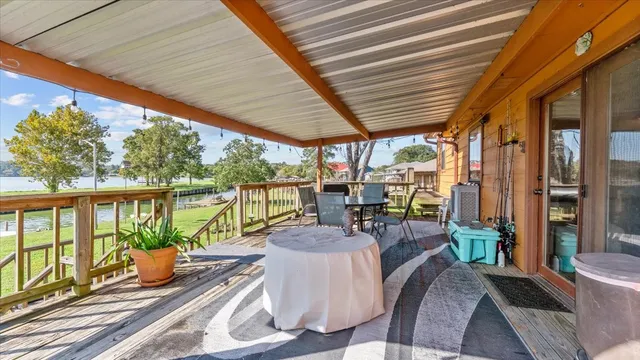 a view of a patio with a dining table and chairs