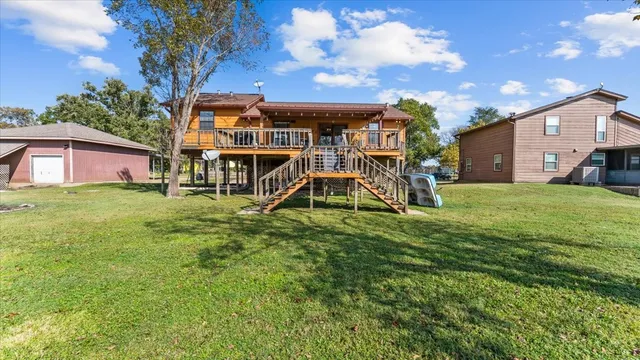 a view of a house with a big yard