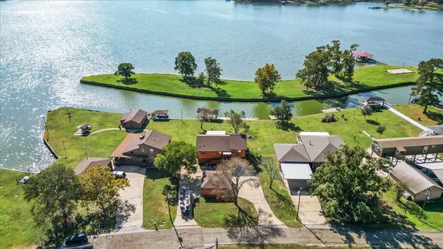 an aerial view of a house with outdoor space