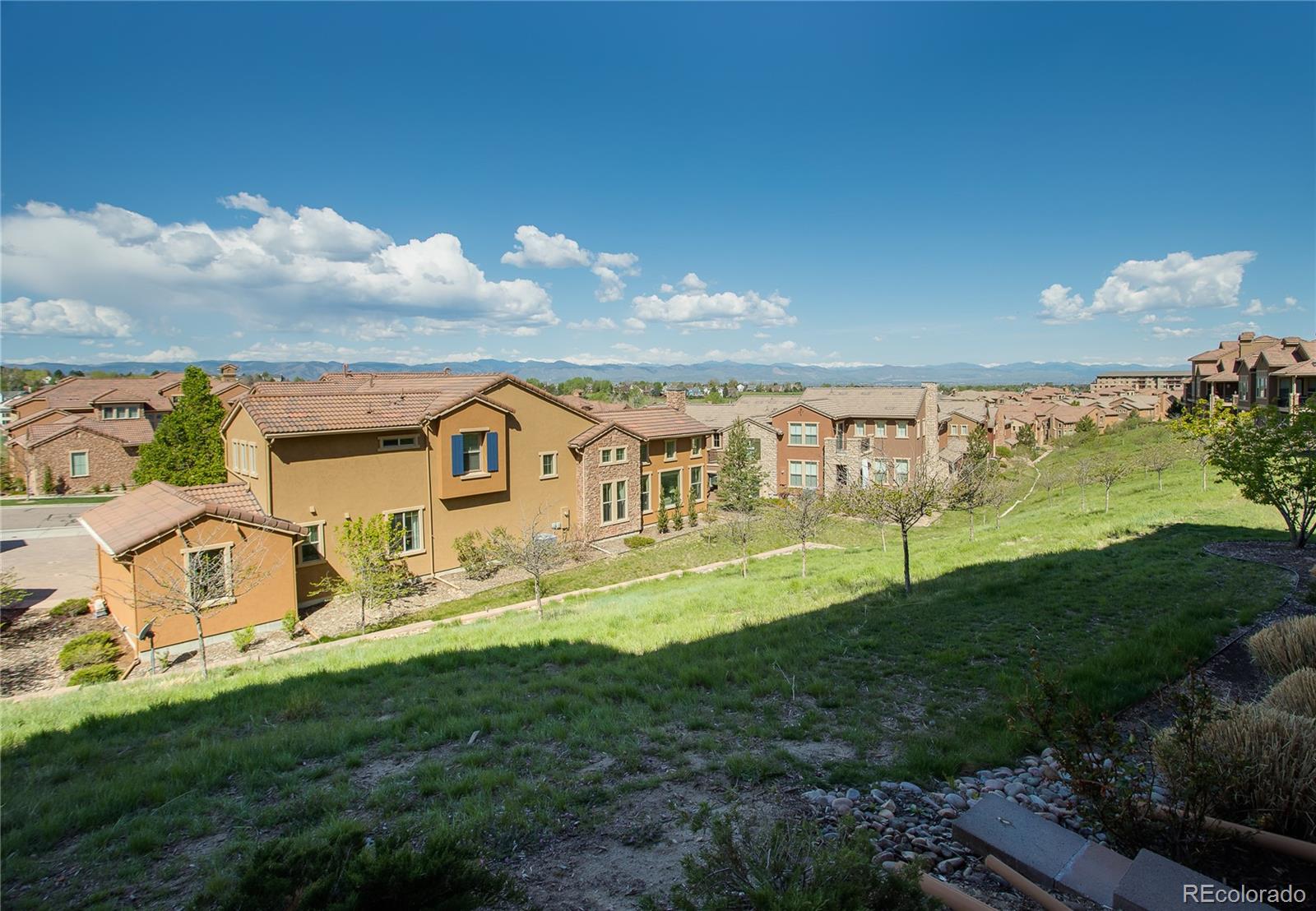 9349 Viaggio Way Highlands Ranch, CO 80126 - Photo 31 of 35 a view of a house with a big yard