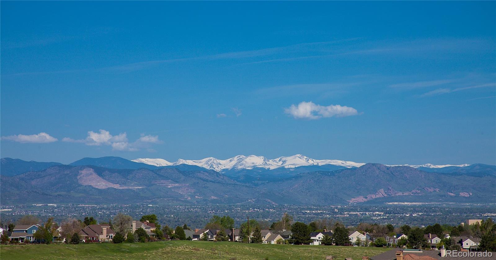 9349 Viaggio Way Highlands Ranch, CO 80126 - Photo 34 of 35 a city view with mountains in the background