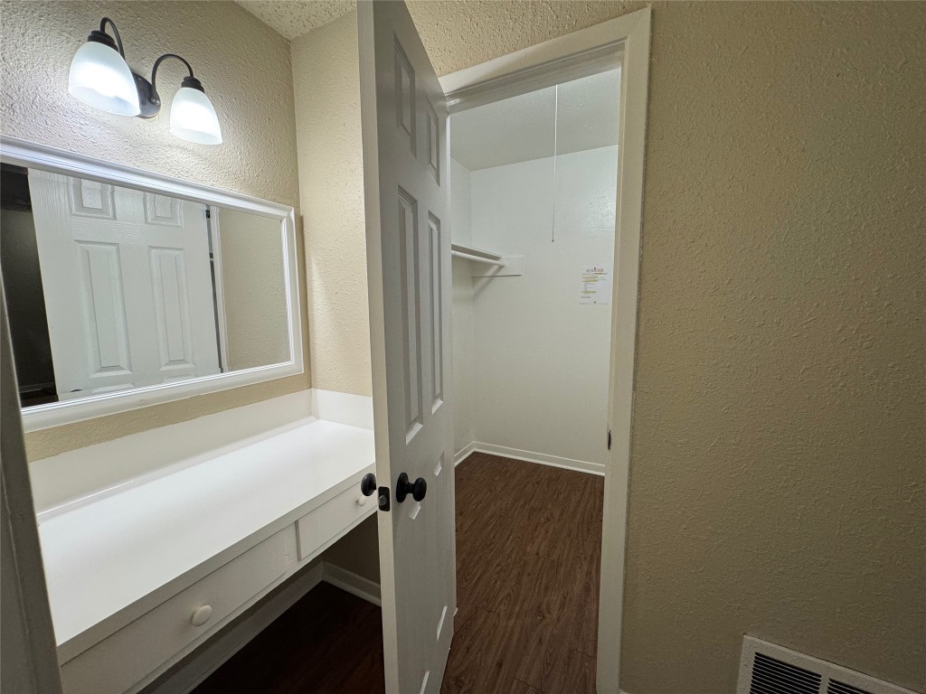 5006 West Wind Trail, Unit 104 Austin, TX 78745 - Photo 13 of 20 a bathroom with a sink and a mirror