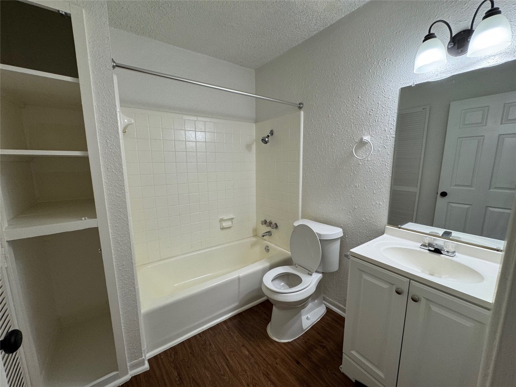 5006 West Wind Trail, Unit 104 Austin, TX 78745 - Photo 14 of 20 a bathroom with a sink toilet and shower