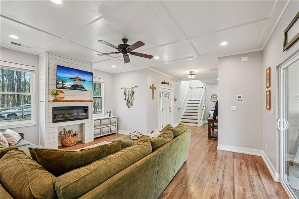 744 Narroway Trail Dallas, GA 30132 - Photo 11 of 59 a living room with furniture and a chandelier