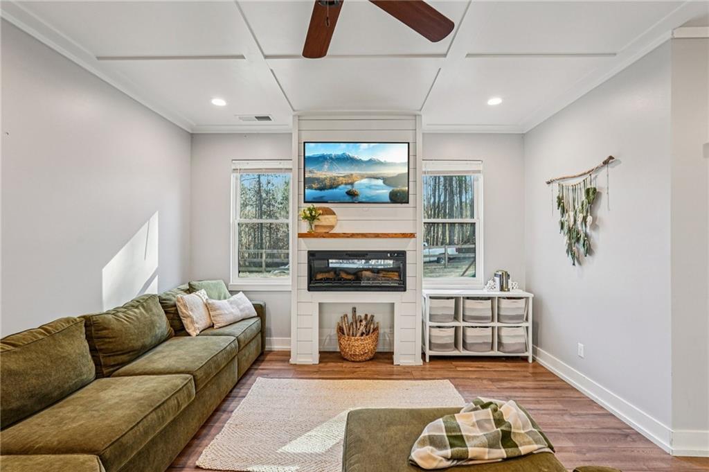 744 Narroway Trail Dallas, GA 30132 - Photo 13 of 59 a living room with furniture a fireplace and a flat screen tv