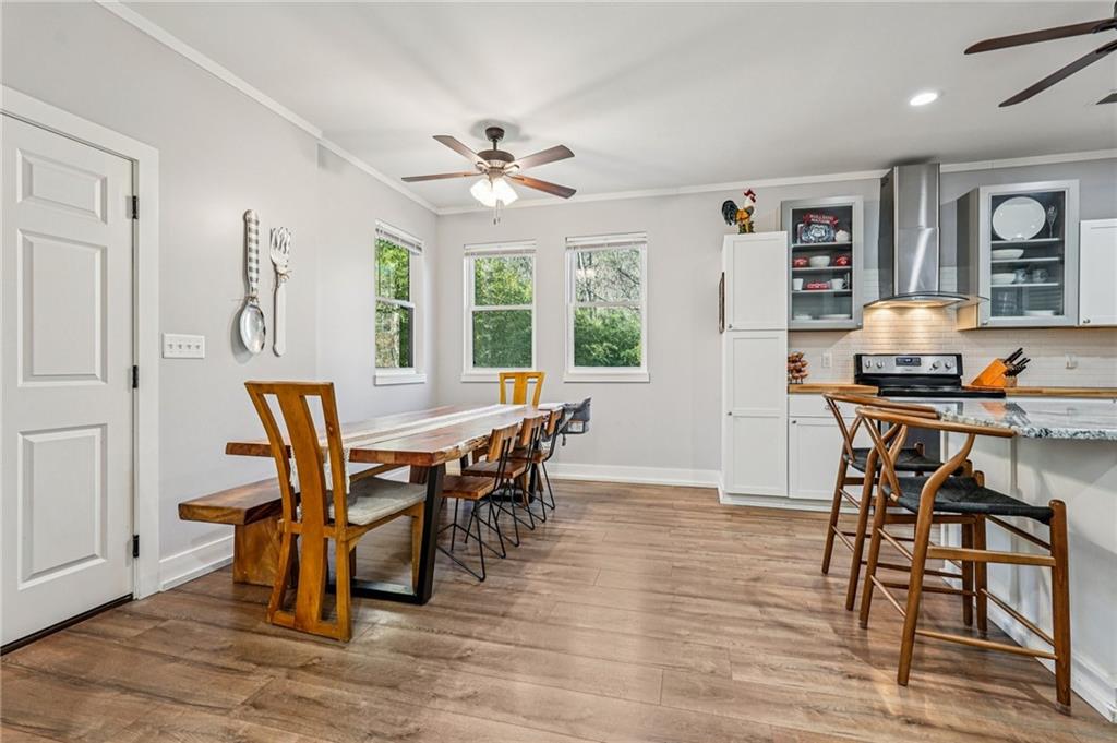 744 Narroway Trail Dallas, GA 30132 - Photo 16 of 59 a dining room with furniture a window and wooden floor