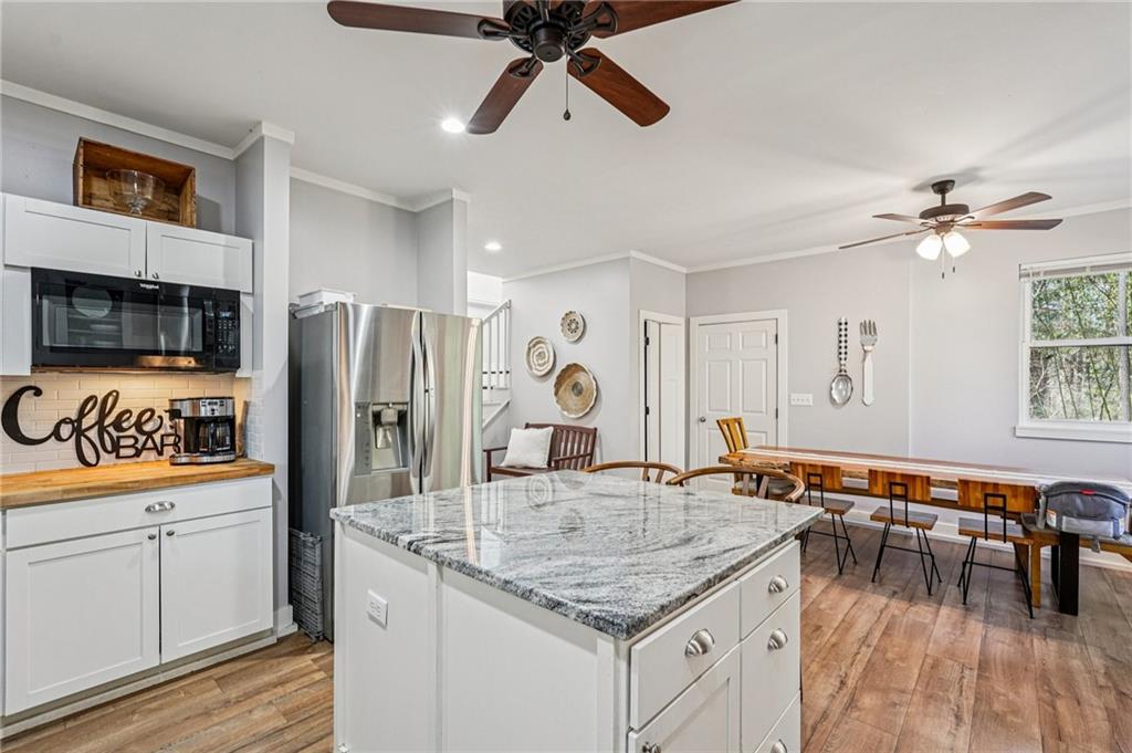 744 Narroway Trail Dallas, GA 30132 - Photo 18 of 59 a kitchen with stainless steel appliances granite countertop a sink and a refrigerator